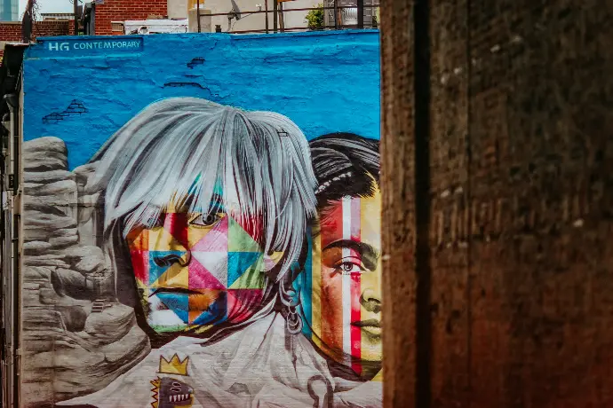 a painting of two men on a wall